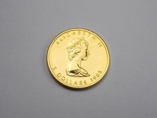 1985 Canadian Maple Leaf 1/10 Oz.  Gold Coin (visible Wear) photo