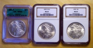 Three Ms65 Certified Bright Uncirculated Morgan Us Silver Dollars photo