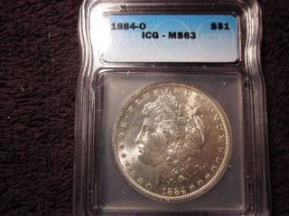 1884 - O Morgan Silver Dollar Icg Ms63 Priced Below Psgs Listed Value. photo