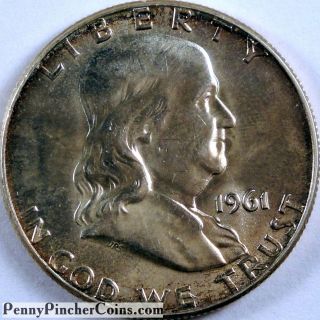 1961 Franklin Half Unc Lightly Toned Uncirculated Coin photo