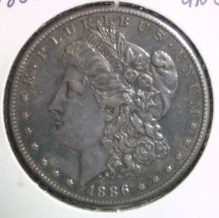 1886 S Silver Dollar,  A U,  Beautifully Toned,  Conditional photo