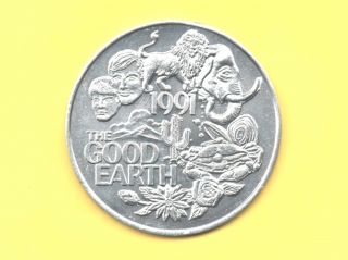 Lion - Elephant Token 1991 The Good Earth Coin photo