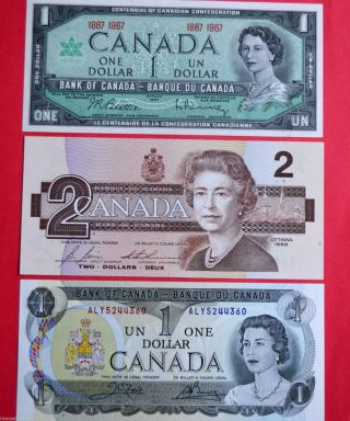 Canadian Bills X 3 - 1967 $1.  00 - 1973 $1.  00 - 1986 $2.  00 photo