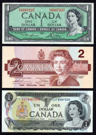 1954 $1.  00,  1986 $2.  00,  1973 $1.  00 Canada Dollars Old Paper Money photo