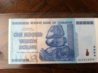One $100 Trillion Dollars Uncirculated Zimbabwe Banknote Printed In 2008. photo