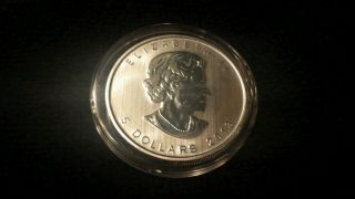 2013 Silver Canadian Maple Leaf In Air - Tite - 1 Troy Ounce - (1) photo