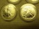 Four (4) American Silver Eagles - - - Uncirculated - - - 1987,  (2) 1994 & 2001 Silver photo 1