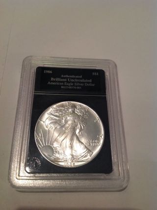 1986 American Eagle Silver Dollar.  Brilliant Uncirculated.  Slabbed photo