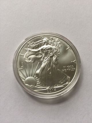 Uncirculated 1 Oz 2014 American Silver Eagle.  999 Fine - In Plastic Snap Case photo