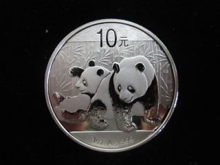 2010 Silver 1oz Chinese Panda 10 Yuan.  999 Fine Silver Coin photo
