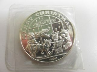 Merry Christmas Toy Store One Ounce Troy.  999 Fine Silver Round photo