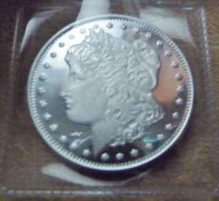 1 Troy Ounce.  999 Silver Morgan Dollar Design Round In Plastic 2 photo
