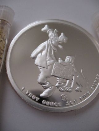 1 Oz.  Silver Proof L.  E.  Disney ' S Goofy,  Pluto,  Donald - Daisey,  Mickey - Minni,  Gold photo