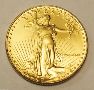 (1) 1986 $50 1oz.  999 Gold American Eagle Coin - First Year photo