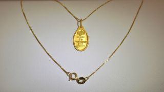 Milor 999.  9 Yellow Gold Sussie 1 Gram Ingot Pendant With 14kt Yellow Gold Chain photo