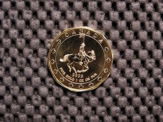 1 (one) 1 - Ounce1997 Canadian Gold Mountie.  999 Fine Gold photo