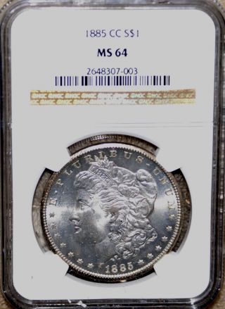 1885 Cc Morgan Dollar Coin Ngc Ms64 Ms 64 Slight Gold Rim Toning Both Sides photo