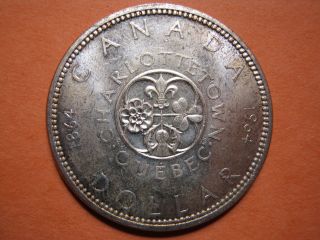Canada 1964 Silver Dollar, .  800 Silver,  Uncirculated,  Coin. photo