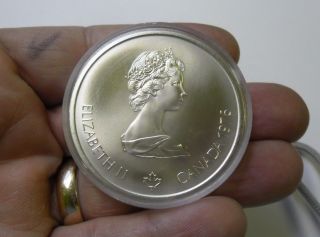 1976 Canada $10 Olympics Silver Commemorative Coin Velodrome,  In Capsule Bu photo