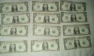 Twelve Dollars $12 Of Low 0 Serial Numbered One Dollar Bills.  2006 - 2009 photo