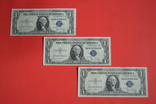 Three 1935 D Consecutive & Uncirculated $1.  00 Silver Certificates photo