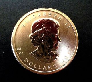 2012 Canadian Maple Leaf 1 Troy Ounce.  9999 Pure Gold $50 - Uncirculated photo