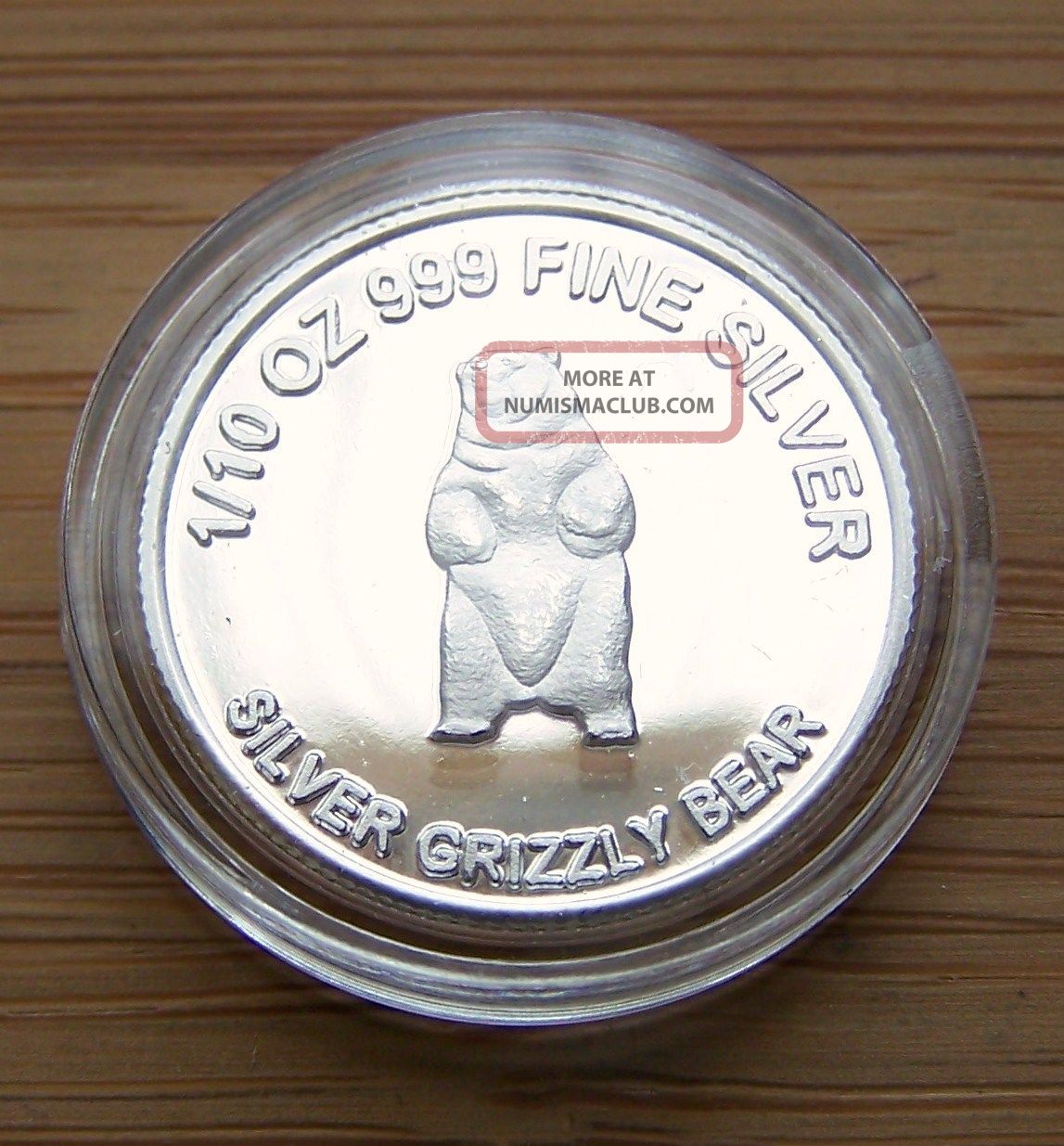 1/10oz.  999 Fine Silver Coin - Grizzly Bear In Capsule Silver photo