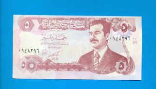 An Iraqi 5 Dinar Bank Note With Saddam Hussein ' S Protrait photo