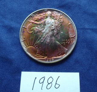 1986 Silver American Eagle With Orange And Green Full Obverse Toning photo