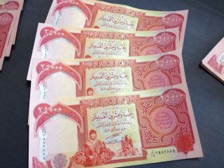 25,  000 Iraqi Dinar Uncirculated $100,  000 Dinar Total photo