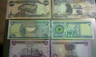 Iraqi Dinar: 2 X 5000,  2 X 500,  2 X 50 = 11,  100 photo