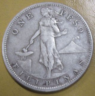 1907 S Filipinas One Peso Silver Very Little Wear photo