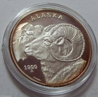 1 Troy Oz.  999 Fine Silver Art Bullion Silver Eagle Round - 1999 Alaska photo