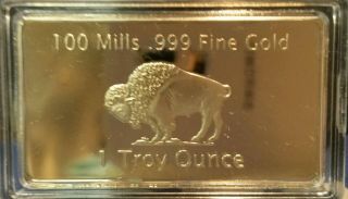1 Troy Ounce Gold Buffalo Bar 100 Mills Clad.  999 24k Fine Bullion Bar. photo