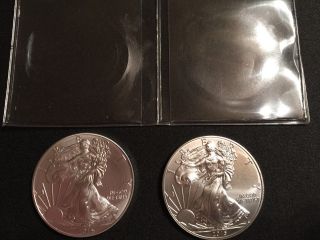 2015 American Silver Eagles X 2; 1 Oz Pure Fine Silver Each With Coin Sheath. photo