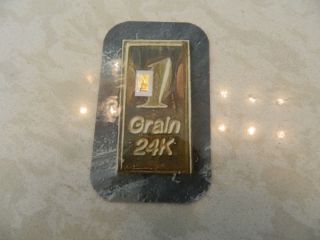 1 Grain Gold Bar.  9999 Fine photo