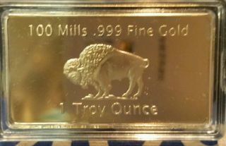 1 Troy Ounce Gold Buffalo Bar 100 Mills Clad.  999 24k Fine Bullion Bar. photo