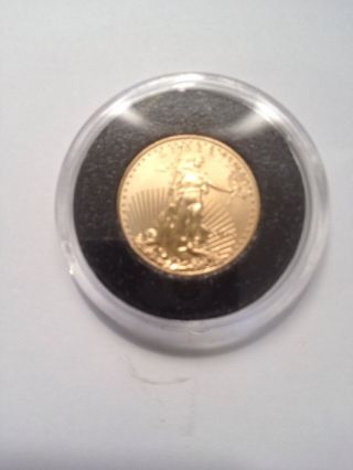 2015 1/10 Ounce American Gold Eagle - Uncirculated - $5.  00 Gold Coin. photo