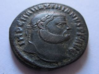 Ae - 27 (follis) Of Maximianus I.  (herculius) From Antioch Rv.  Genius photo