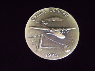 Longines Symphonette 1935 China Clipper 1.  11.  999 Fine Silver Medal 1972 Coin photo