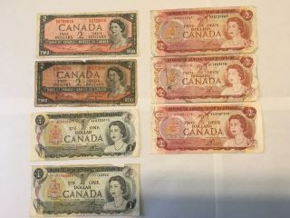 Canadian Paper Bills Circulated (2x1954 $2 Bills) (3x1974 $2 Bills) 2x1973 $1 Bill photo