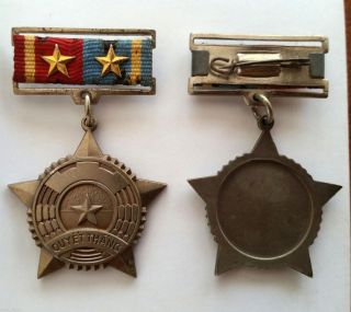 Vietnam Nva Viet - Cong Medal; Two Gold Stars,  ' Victory ' Legend On Obverse.  Bronze photo