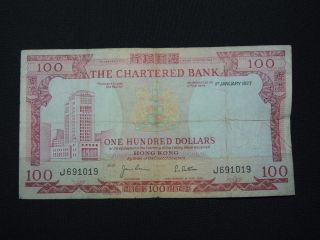 1st January 1977 100 Hong Kong Dollar Bank Note The Chartered Bank J691019 F photo