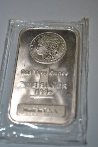 One Troy Ounce.  999 Fine Silver Morgan Silver Bar photo