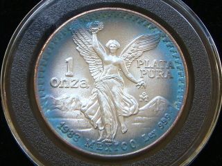 1983 Rim Toned Mexican Libertad 1 Ounce.  999 Fine Silver Coin. photo