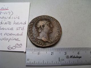 Roman: Trajan 98 - 117 Ad.  Ae Dupondius.  Rev; Abundance Standing.  Cos Iiii=102/03 photo