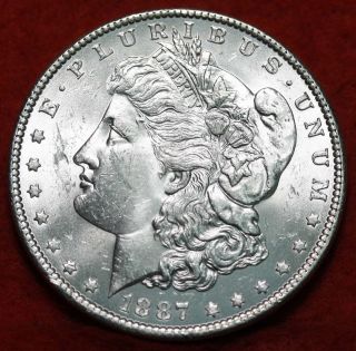 Uncirculated 1887 Silver Morgan Dollar S/h photo