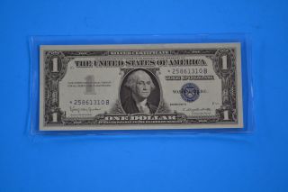 One 1957 B Uncirculated $1.  00 Silver Certificate Star Note photo