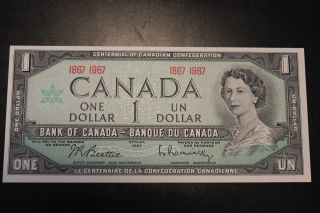 Canadian 1967 $1 Bill With Date.  The Bill Is,  Crisp & Uncirculated. photo