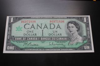 Canadian 1967 $1 Bill With Serial Number.  The Bill Is,  Crisp & Uncirculated photo